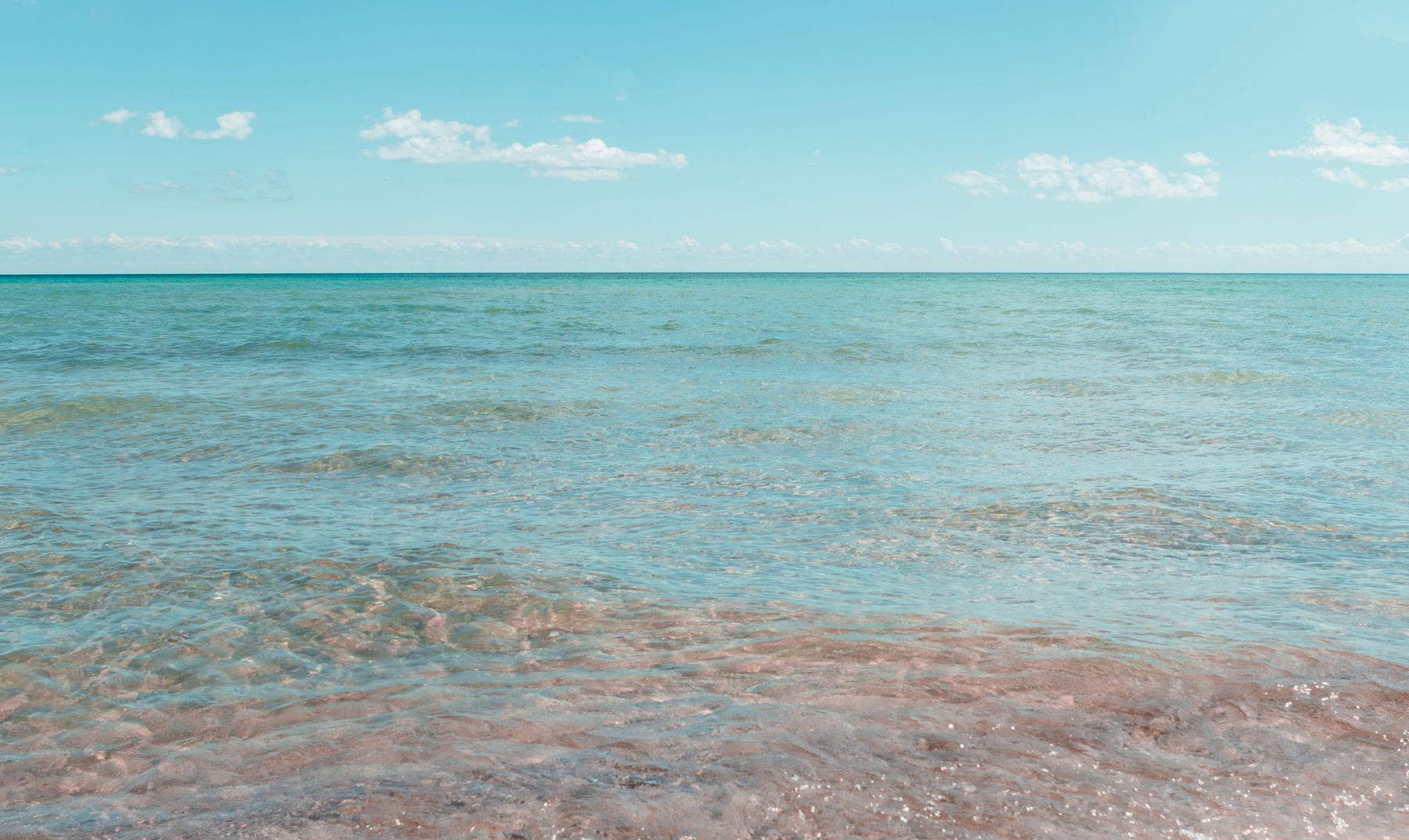 Clear shallow water along the Lake Huron shoreline at East Tawas, Michigan